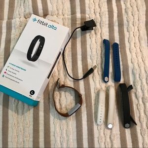 Fitbit Alta with several bands!